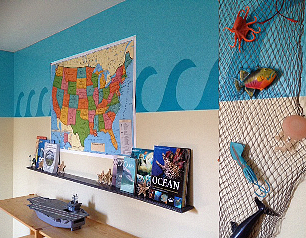 I build that shelf to hold all of his ocean books. The map is for marking all the Aquariums we visit in the United States.